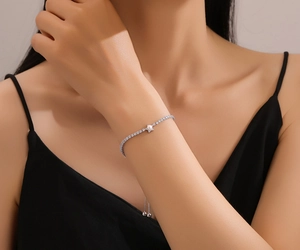 Detail of adjustable S925 sterling silver star bracelet with pearls and pavé stones