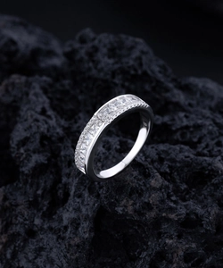 Macro detail of S925 sterling silver eternity ring with square-cut cubic zirconia stones