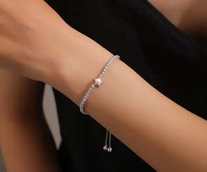 Macro shot of S925 sterling silver star bracelet with pearl and adjustable slider clasp