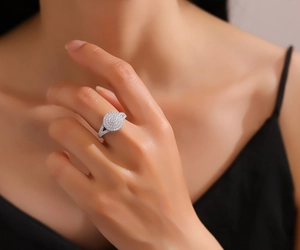 Detailed close-up of a luxury S925 sterling silver full zircon ring worn on a finger