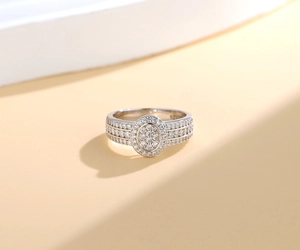 Detail of S925 sterling silver ring with triple-row pavé diamonds and oval cluster design