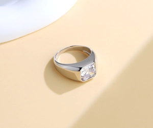Macro view of S925 silver ring featuring a large square-cut zircon stone on beige surface