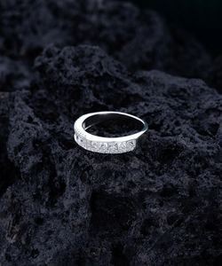 Detailed close-up of a S925 sterling silver band ring with sparkling 5A zircon stones