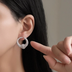 Modern S925 sterling silver U-shaped hoop earrings with sparkling zircon crystals on model