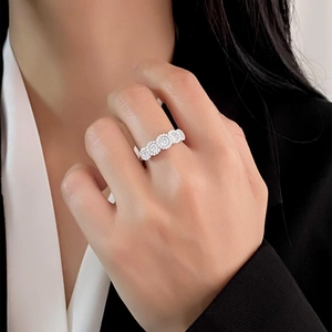 Elegant S925 sterling silver ring with four round diamond clusters on a female hand