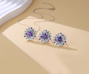 Detail view of S925 silver daisy jewelry set with purple gemstones and pavé stones