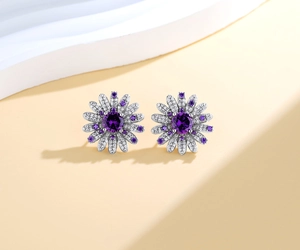 Macro detail of S925 silver daisy earrings with purple gemstones and white zircon stones