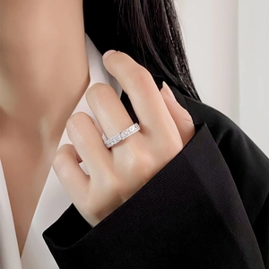 Sparkling S925 sterling silver eternity ring with square cubic zirconia on a female hand