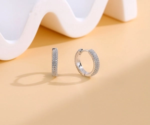 Detailed view of S925 sterling silver double-layer huggie earrings with pavé zircons