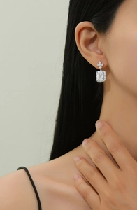 Close-up of S925 sterling silver drop earrings with rectangular emerald-cut zircon stone