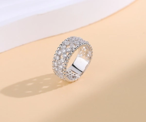 Macro view of 925 silver wide ring with pave zircon and milgrain bead edge detail