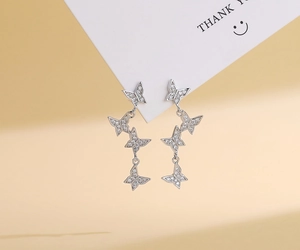 Detailed view of S925 sterling silver butterfly earrings with micro-set cubic zirconia