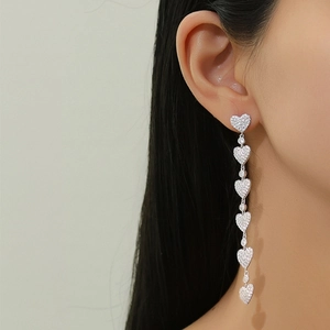 Elegant S925 silver fringe earrings featuring six sparkling pavé-set heart drop tassels