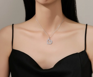 Detailed close-up of a heart-shaped S925 silver necklace with micro-pave crystals