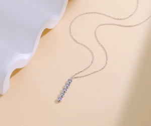 Detail view of five sparkling cubic zirconia pendants on a S925 sterling silver chain
