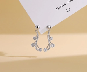 Macro shot of S925 sterling silver flower earrings with zircon vine fringe tassels