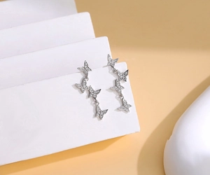 Detailed view of S925 silver butterfly tassel earrings with pavé-set cubic zirconia crystals