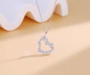 Close-up of S925 sterling silver heart pendant with micro-set star cubic zirconia