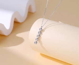 Detail of S925 silver necklace featuring five vertical sparkling round zircon stones