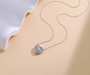 Macro shot of 925 sterling silver heart pendant necklace with shimmering cubic zirconia