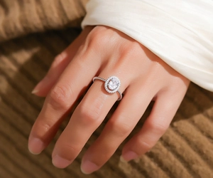 Macro shot of S925 sterling silver ring with oval moissanite stone and twisted band