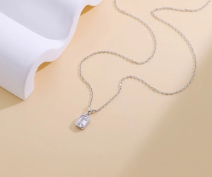 Detailed macro shot of an S925 sterling silver necklace featuring a square cubic zirconia pendant