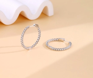 Close-up of S925 sterling silver hoop earrings with micro-paved moissanite stones