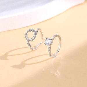 Elegant S925 sterling silver stacking ring set featuring pavé diamonds and a main solitaire