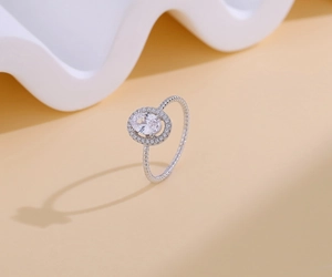 Close-up of S925 silver halo ring with oval stone and twisted rope band texture
