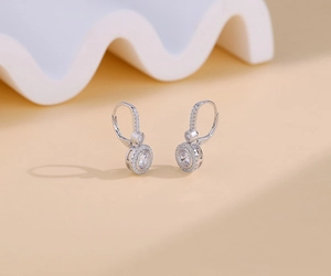 Detailed macro shot of S925 silver halo lever-back earrings with shimmering pave zircon