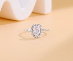 Close-up of S925 silver halo ring featuring oval moissanite and twisted rope band details