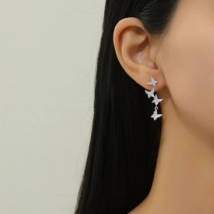 Elegant S925 silver butterfly tassel earrings with pavé zircons on model ear