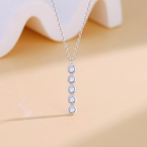Minimalist S925 silver necklace featuring five sparkling round-cut clear gemstones