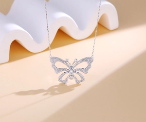Detailed view of sterling silver butterfly necklace with sparkling pave cubic zirconia