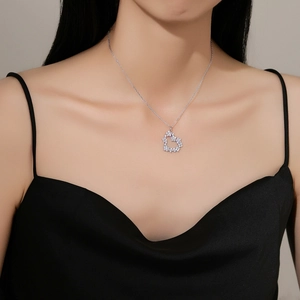 S925 silver heart necklace with micro-pave crystals on a model for an elegant look