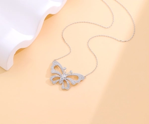 Detailed close-up of hollow butterfly pendant necklace with pavé cubic zirconia