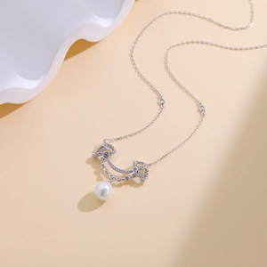 Elegant S925 silver necklace with sparkling pavé crystal smile pendant and white pearl