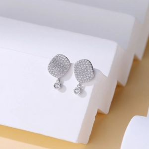 S925 sterling silver square stud earrings with pave zircon displayed on white steps