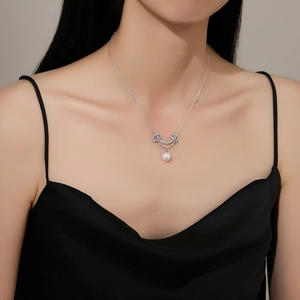 Elegant S925 sterling silver smile necklace with pearl pendant on model neck