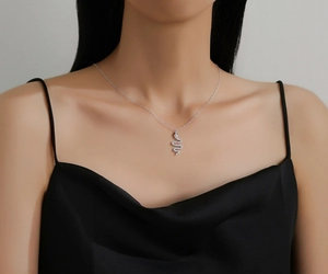 Detailed view of S925 sterling silver snake pendant necklace with sparkling zircon pavé