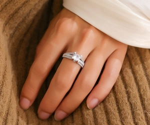 Close-up of S925 silver moissanite ring with devil horn design on a female hand