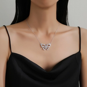 Elegant hollow butterfly pendant necklace in silver with sparkling cubic zirconia stones