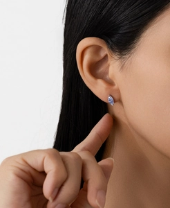 Close-up of S925 sterling silver ear stud with marquise-cut 0.5ct blue moissanite gemstone