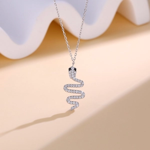Luxurious S925 sterling silver snake necklace with sparkling pave diamonds and black eyes