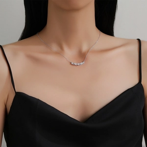 Elegant S925 sterling silver wavy necklace with micro-paved diamonds on a female model