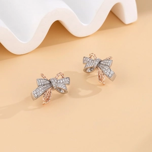 S925 sterling silver bow earrings with two-tone gold plating and pave crystals