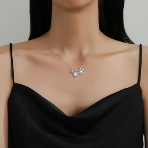 Elegant double snowflake pendant necklace with cubic zirconia on a silver chain