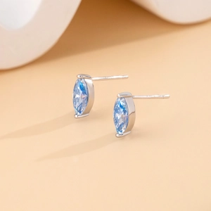 Marquise cut sea blue moissanite stud earrings in S925 sterling silver on white stand