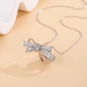 Elegant S925 silver bow necklace with rose gold accents and sparkling cubic zirconia stones