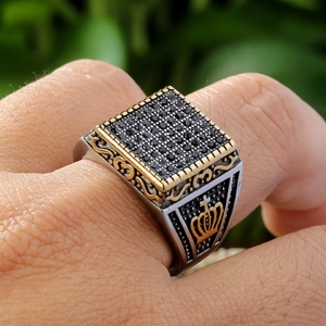 Men's titanium crown signet ring with black square stones in a silver and gold finish